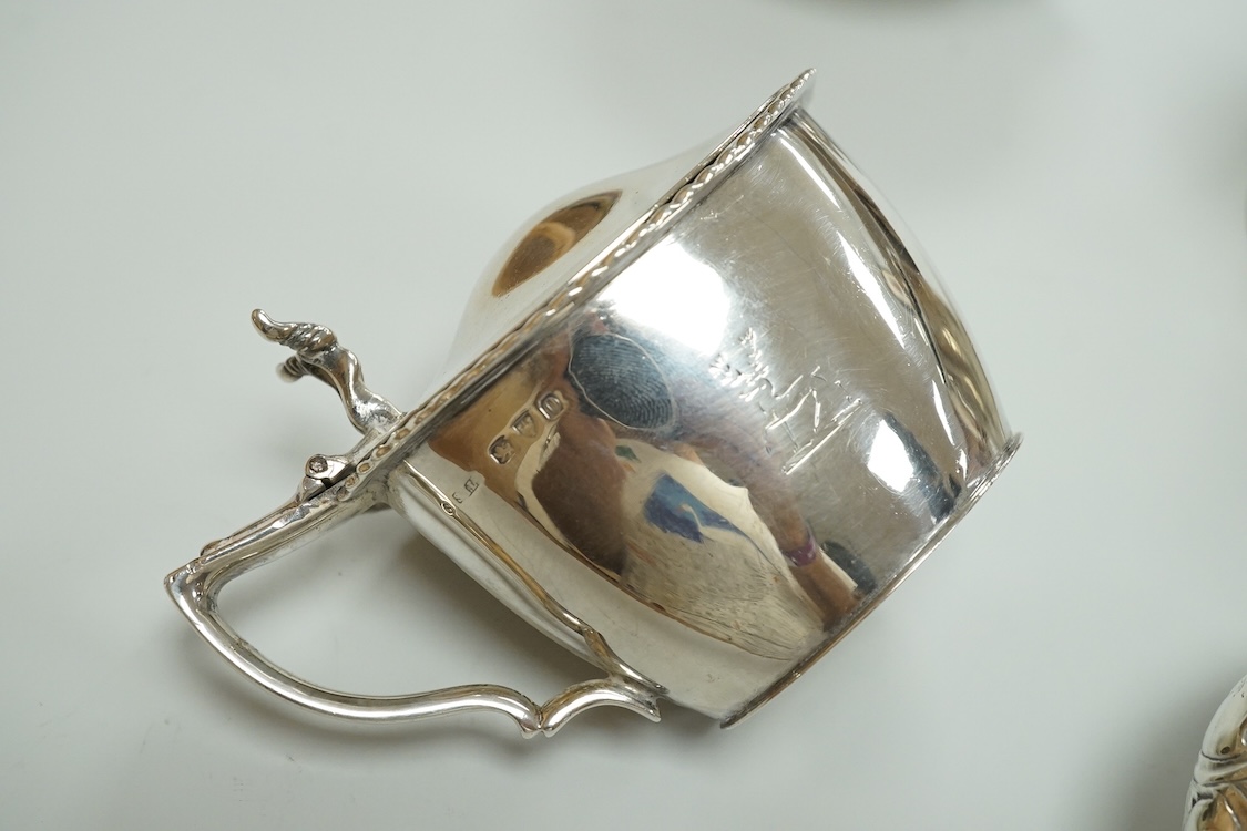 A Victorian silver drum mustard pot, a pair of later silver mustard pots and two silver salts including Victorian.